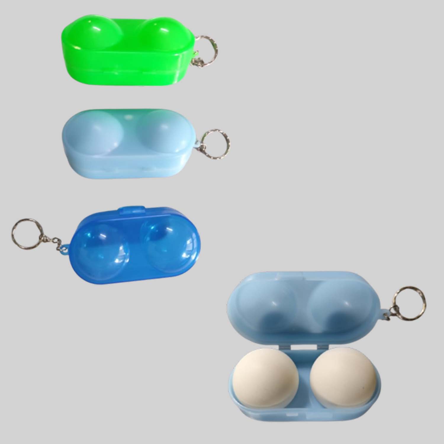 Three table tennis ball boxes in green, and shades of blue colors with keychain attachments.